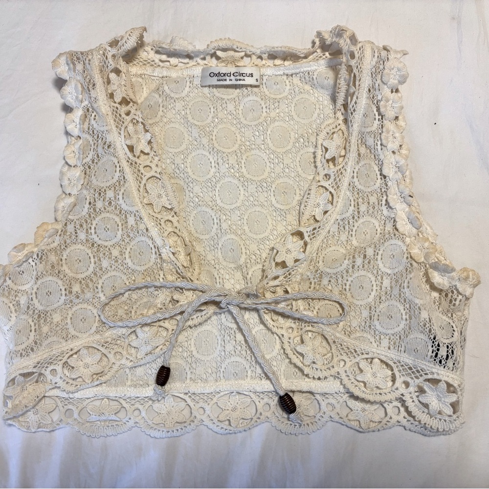 Cream colored lace vest